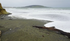 The waves sweeping high up Gemstone Beach this morning, just before high tide.